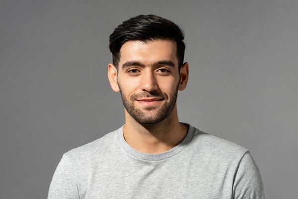 files/close-up-portrait-of-smiling-handsome-young-caucasian-man-face-looking-at-camera-on-isolated-light-gray-studio-background-photo.jpg